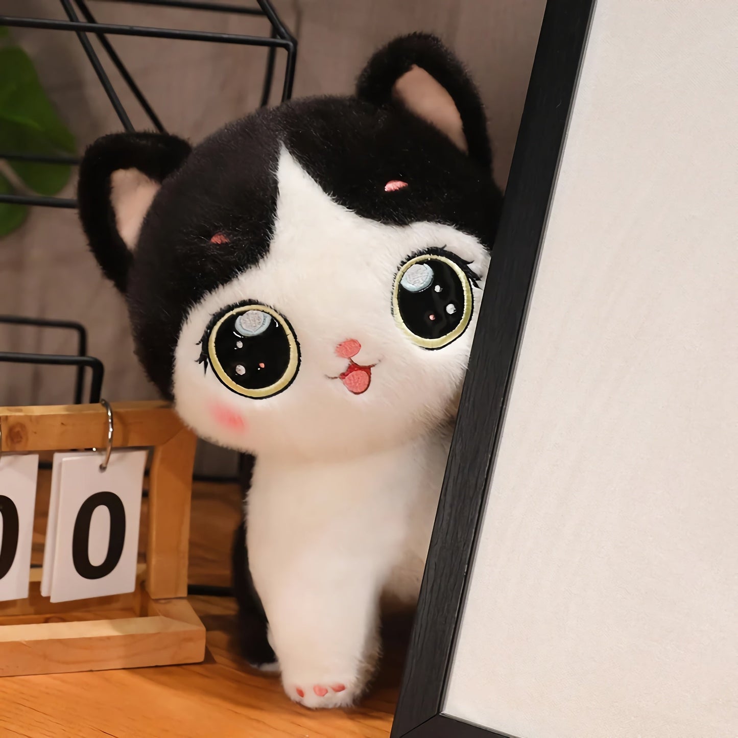 Adorable peluche chaton aux grands yeux