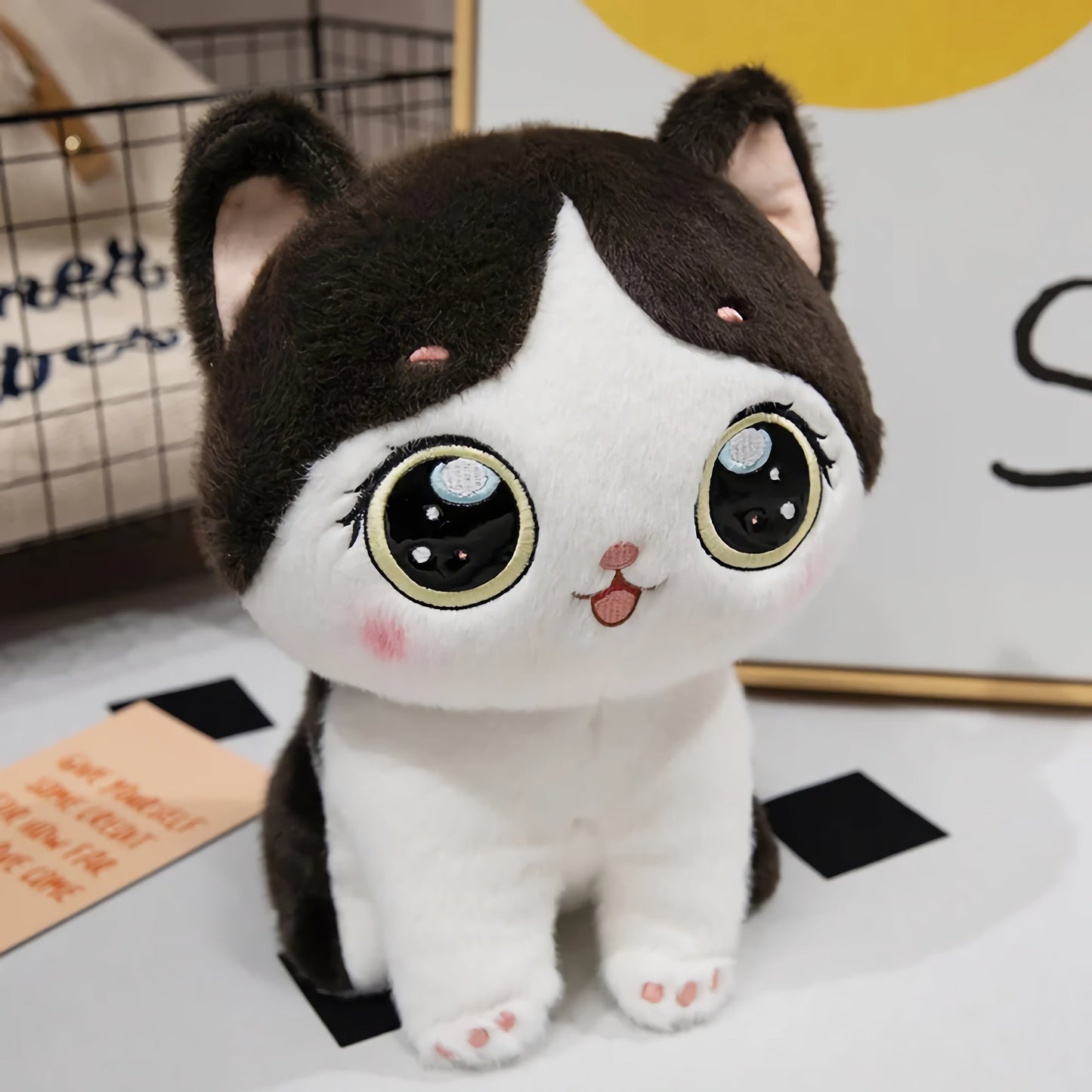 Adorable peluche chaton aux grands yeux
