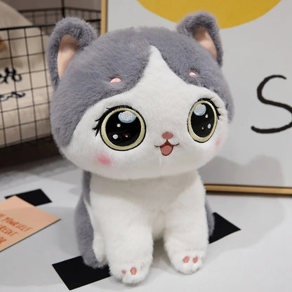 Adorable peluche chaton aux grands yeux